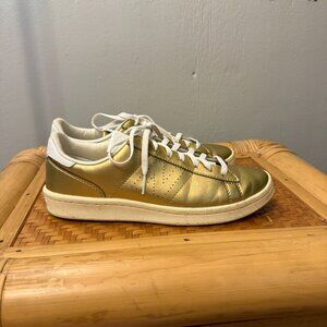 Metallic gold New Balance sneakers